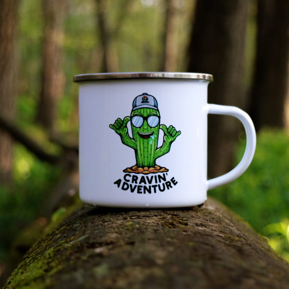 A camping mug on a log in the forest