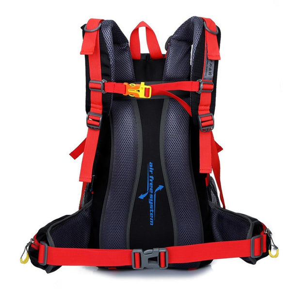 The back of a red hiking backpack which shows the straps and the back support